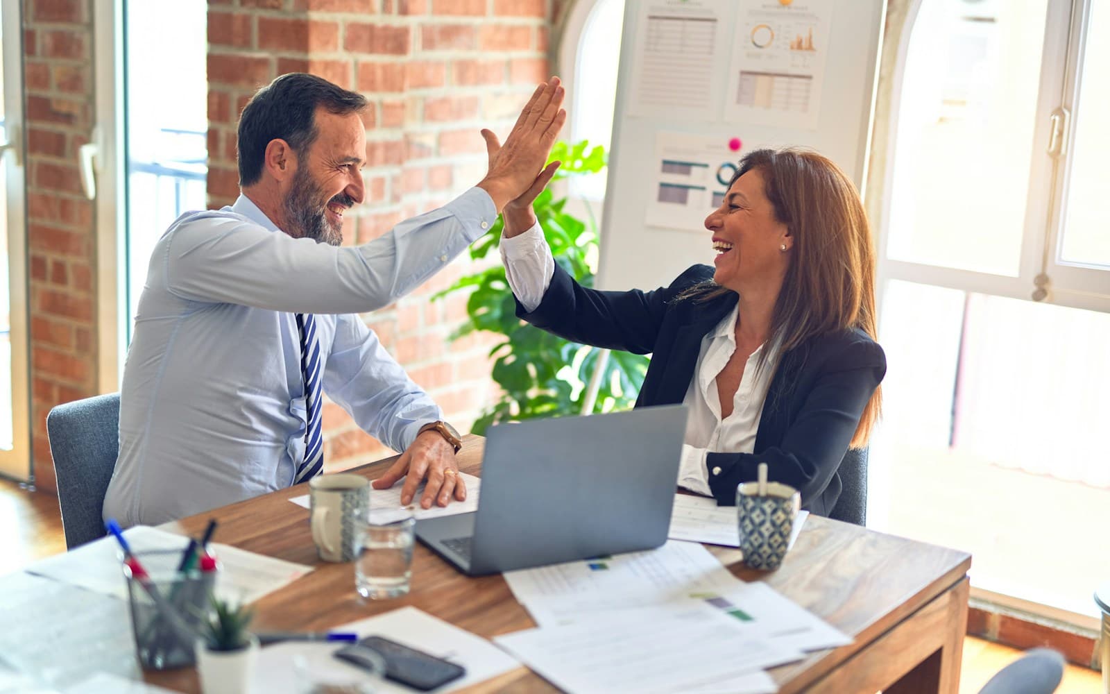 Professionals collaborating in a modern workplace meeting
