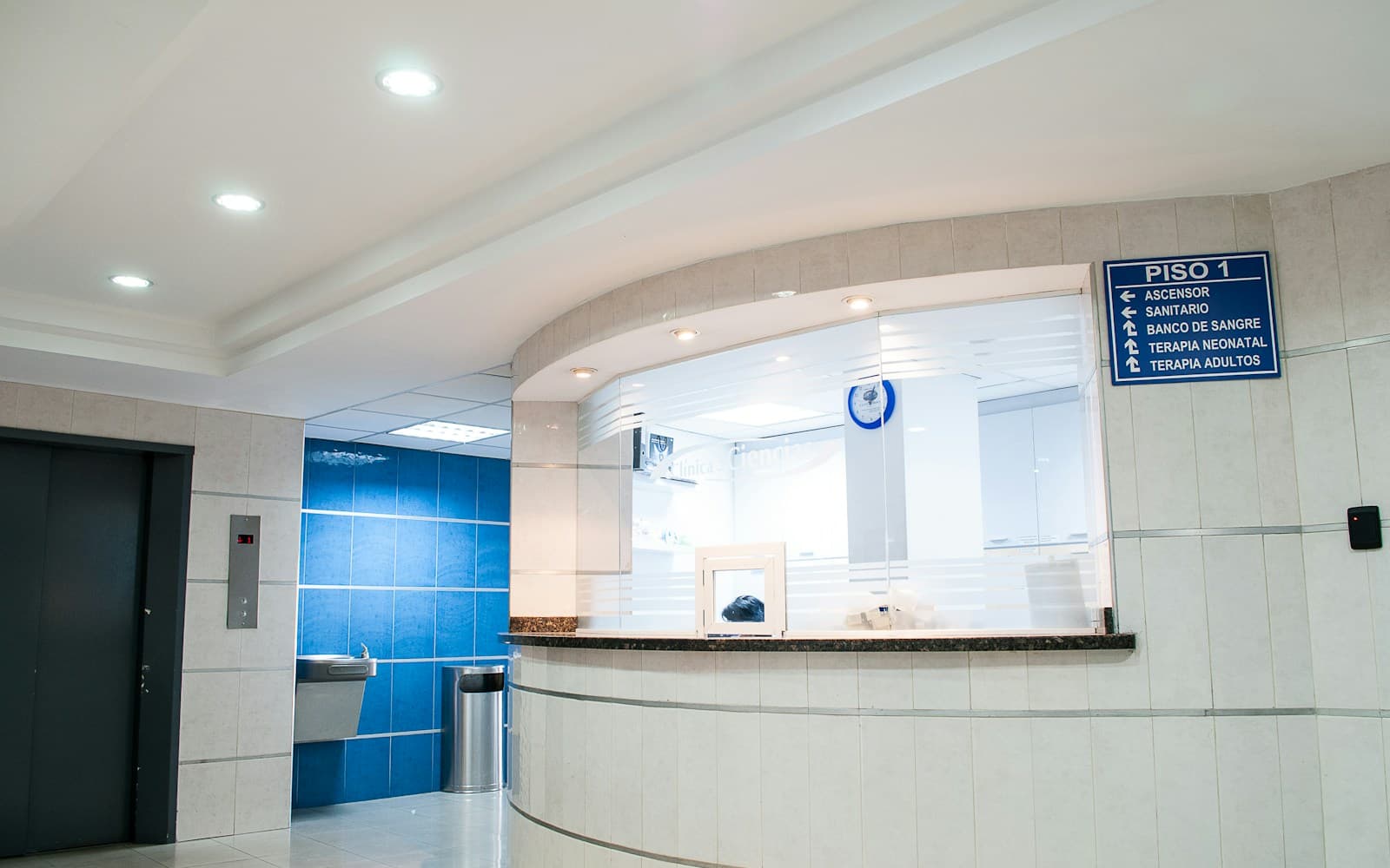 Modern hospital lobby and reception serving multilingual patients