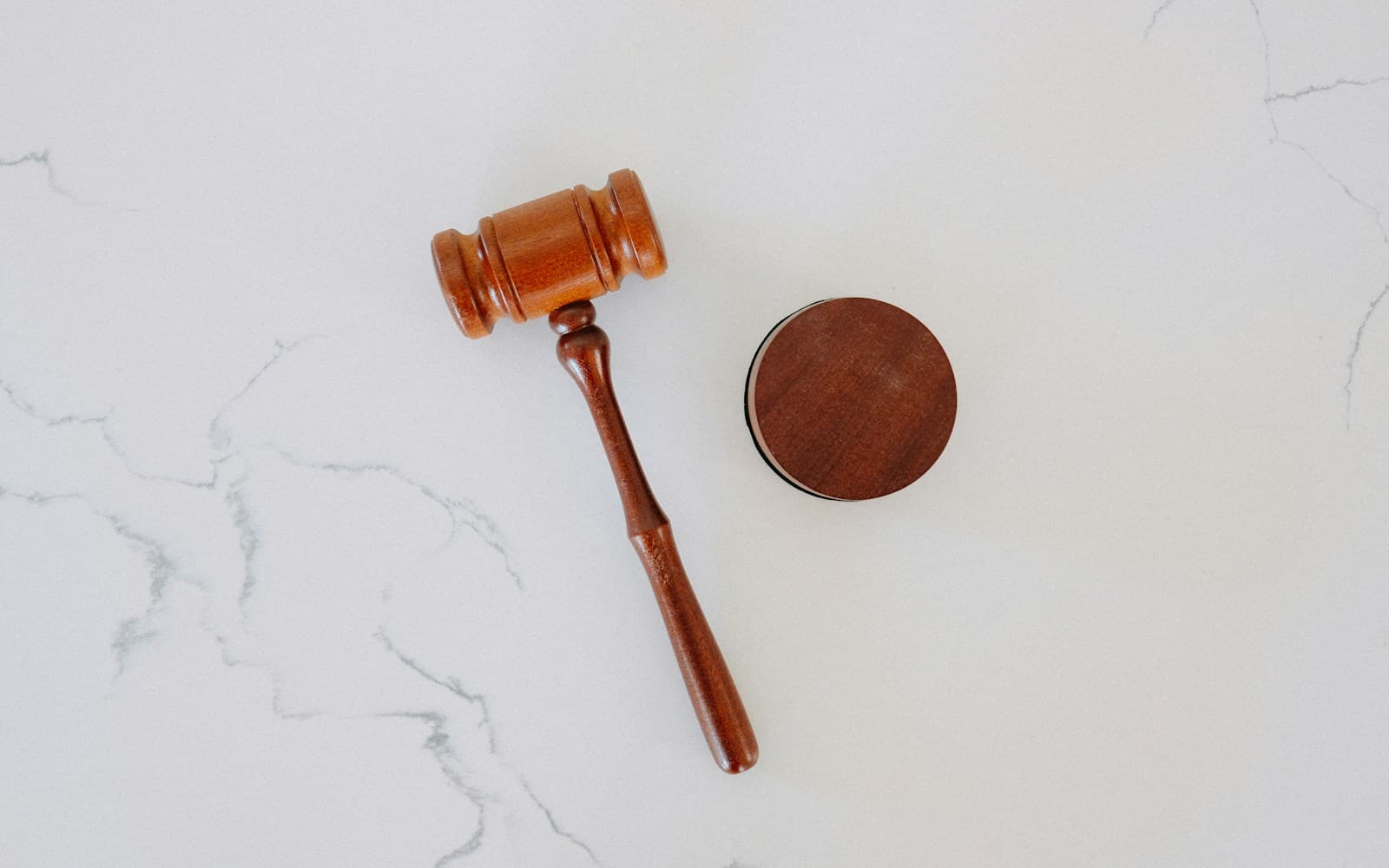 Wooden gavel on marble for legal interpreting settings