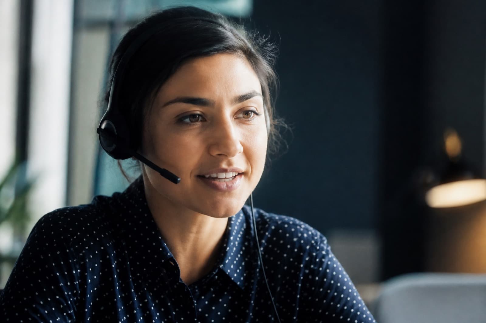 Professional interpreter on a phone interpreting session with a headset